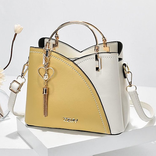 marineblaue und rosa Handtasche für Damen mit Herzquastenanhänger – elegante Umhängetasche und Tragetasche aus Kunstleder für den täglichen Gebrauch