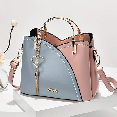 marineblaue und rosa Handtasche für Damen mit Herzquastenanhänger – elegante Umhängetasche und Tragetasche aus Kunstleder für den täglichen Gebrauch