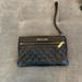 Michael Kors Bags | Michael Kors Wristlet. Black And Gold Good Condition ! | Color: Black | Size: Os