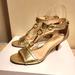 Coach Shoes | Coach "Inez" Gold Nappa Leather T-Strap W/Gold Horse-Bit Sandals Sz.7 Msrp $235 | Color: Gold | Size: 7