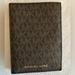 Michael Kors Other | Brand New- Michael Kors- Jet Set Travel Passport Holder Wallet- Brown Pvc | Color: Brown | Size: Os