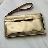 Kate Spade Bags | Kate Spade Camellia Street Jemima Bow Gold Patent Leather Lg Wristlet Bag Purse | Color: Gold | Size: See Pictures