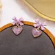 Noeud papillon rose carillon coréen pour femme oreille goutte de coeur à paillettes conviviale