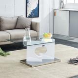 A rectangular modern and fashionable coffee table with tempered glass tabletop and white MDF legs