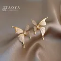 Boucles d'oreilles papillon asymétriques en émail blanc liquide pour femmes bijoux fantaisie