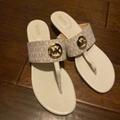 Michael Kors Shoes | Michael Kors Women Sandal. Never Worn. White/Cream Mk Monogram With Gold Mk | Color: White | Size: 10