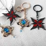 Porte-clés de jeu avec insigne de collier Arlecchino figurine d'anime porte-clés pendentif