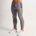 Per uomo Pantaloni della tuta Pantaloni Running Pantaloni da pista Tasche A cordoncino Cinturino elastico Pantalone / Sovrapantaloni Esterno Sportivo Al coperto Cotone Traspirante Morbido Maratona