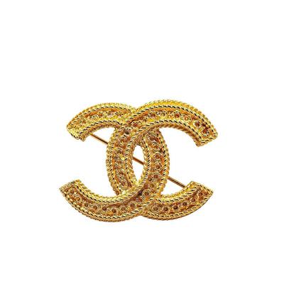 Chanel Brooch: Gold Jewelry