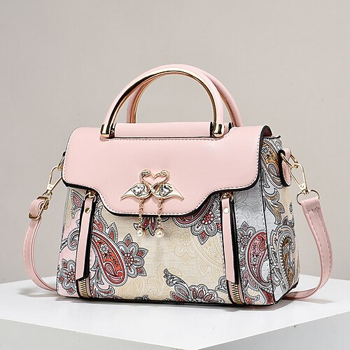 Elegante Damenhandtasche mit Schwanenanhänger – schwarz-weißes Paisley-Design mit goldenen Akzenten und verstellbarem Riemen