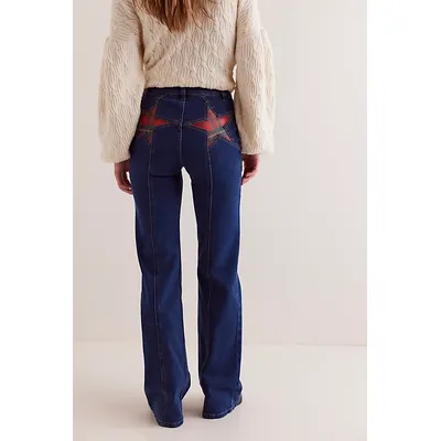 We The Free Firecracker Flare Jeans at Free People in Holiday Tartan, Size: 31