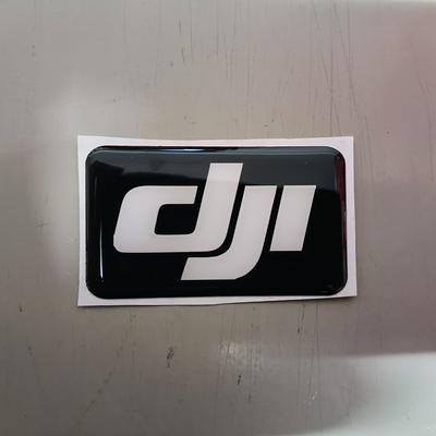TEMU A Universal Logo Hard Plastic Reusable Sticker Accessory For Dji Drone Storage Bags. Image