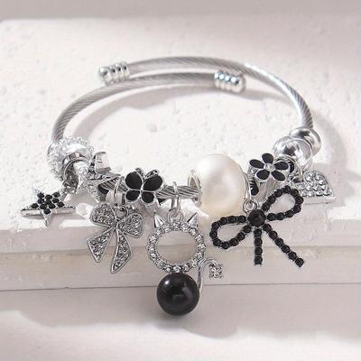 TEMU 1pc Elegant Charm Bracelet With , Rhinestone Star & Bow Charms, Black Enamel Accents, And Cat Charm - Ideal For Parties, Vacations, And , Vacation Jewelry | Sophisticated Jewelry | Decorative Bow Image