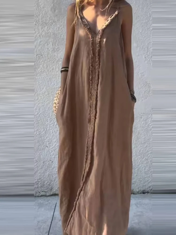 Abito lungo sexy con scollo a V e tasca a vita alta. Elegante abito lungo da donna con giunture con nappe. Abiti da festa larghi senza maniche alla moda