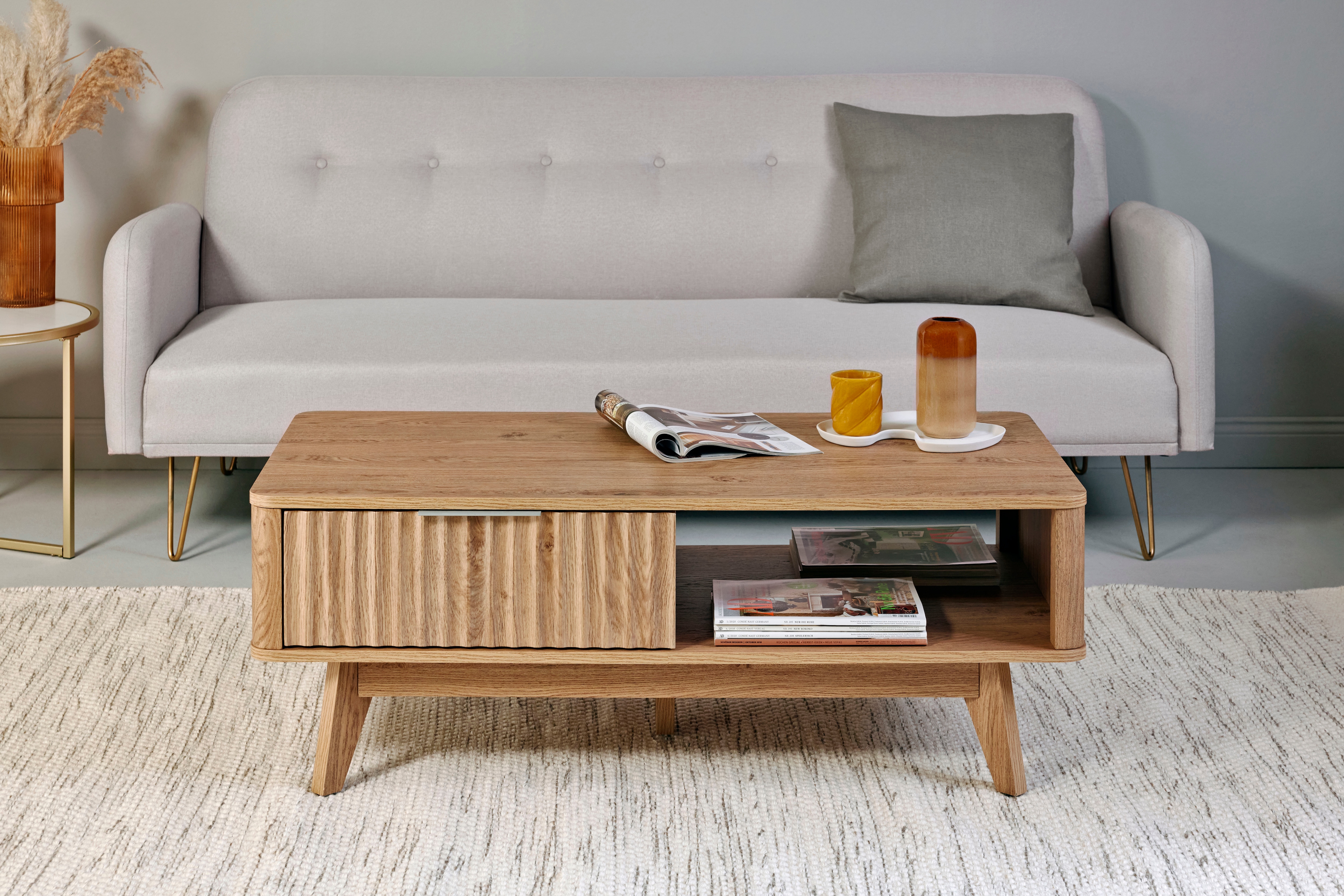 Couchtisch JAHNKE "WAVE COFFEE SK", braun (montana eiche, montana eiche, montana eiche), B:110cm H:44cm T:55cm, Tische, Couchtisch, Retro-Stil, Stauraum, Fronten in raffiniertem Wellendesign