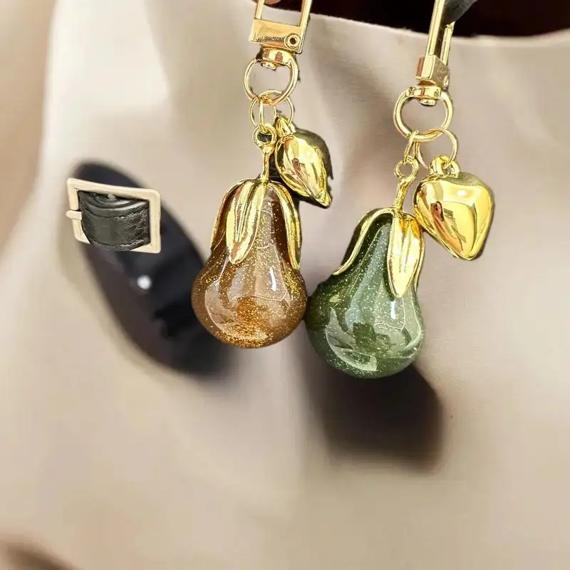 Edler, von Früchten inspirierter Schlüsselanhänger; Stilvolles Taschenzubehör; Perlenanhänger aus hochwertigem Kunstharz; Ideales Geschenk für Paare. Image
