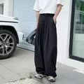 Pantaloni da abito neri da uomo Pantaloni eleganti da uomo sociali di moda oversize Pantaloni coreani larghi a gamba larga Pantaloni formali da ufficio da uomo M-3XL