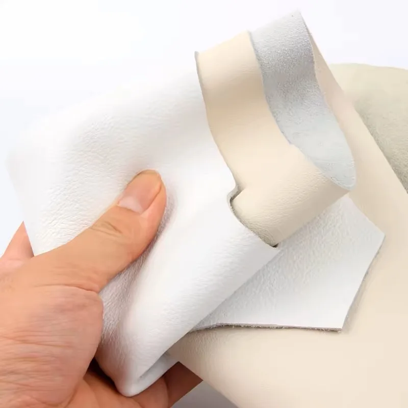Material aus feinkörnigem Rindsleder, cremefarbenes Leder, nicht schlicht gewebtes Sofa, Esszimmerstuhl am Bett, runder Hocker, weich bezogen, ganzes Stück