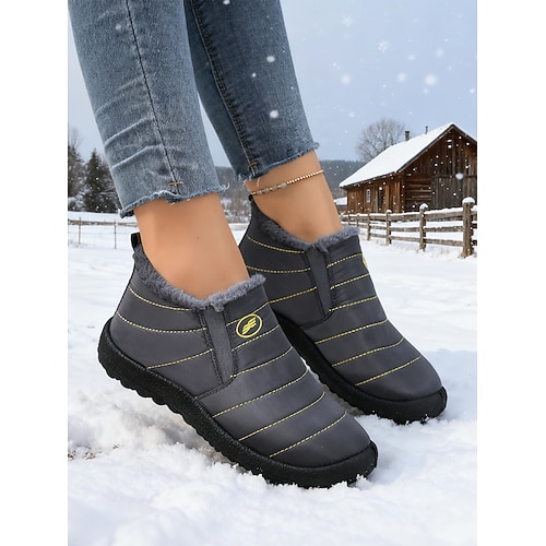 orangefarbene, wasserdichte Schneestiefel für Damen mit warmem Plüschfutter, leichte Winterschuhe zum Hineinschlüpfen für kaltes Wetter im Freien und im Halloween-Stil Image