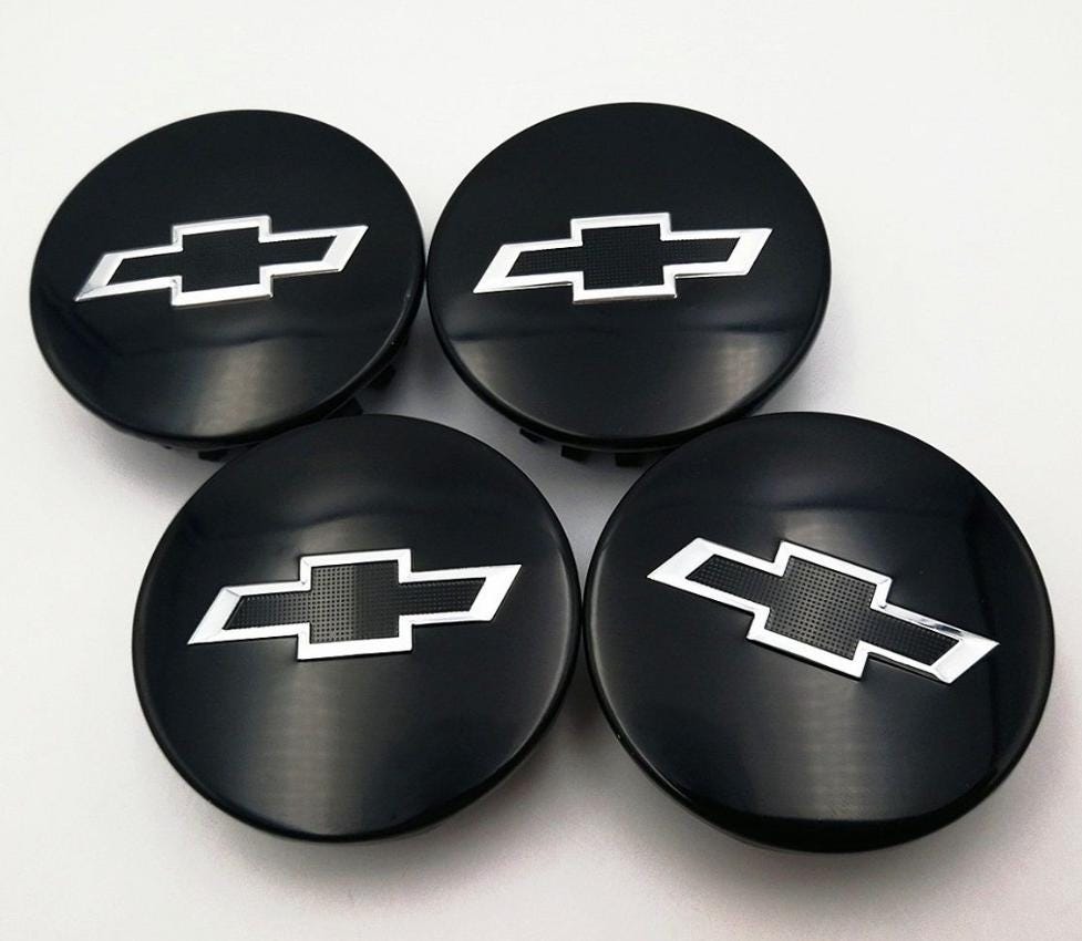 Coprimozzi per cerchi Chevrolet 4 x 68 mm neri con set di 4 pezzi OEM 23115617 Emblemi per cerchi Chevy di ricambio con logo Nuovo