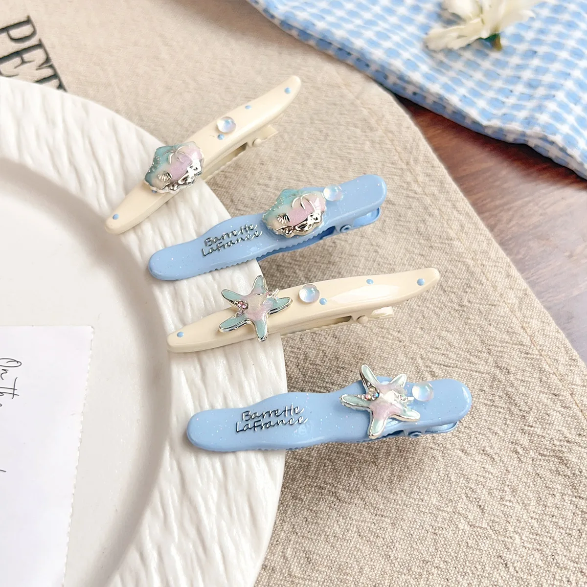 Neue Ocean Series Blue and White Edge Clip Dream Starfish Shell Pearl Broken Hair Clip Urlaubsstil Nahtlose Pony Clip Image
