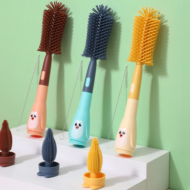 Wasserbecher-Reinigungsbürste, Strohbürste, Pinguin-förmige Schnullerbürste, Babyflaschenbecherbürste, drei in einem Silikon-Babyflaschenbürste Image
