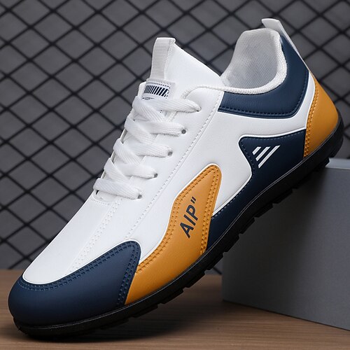 Weiße und blaue Herren-Sneaker aus Kunstleder – elegant und bequem für Alltag, Reisen und Freizeit. Image