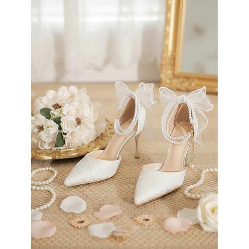 Elegante Brautpumps mit spitzer Zehenpartie, elfenbeinfarben, perlen- und schleifenverziert, für Gartenhochzeiten Image