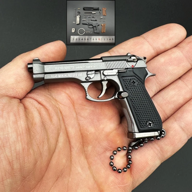 Neu mit Inschrift 7 Kugeln 1:3 Vollmetall 92F Pistolenmodell Legierung Schlüsselanhänger Anhänger Abnehmbares Dekompressionsspielzeug Herrengeschenk Image