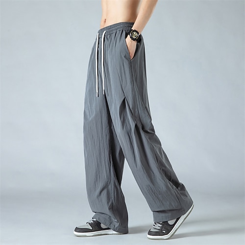 Herren Hose Freizeithose Sommerhose Baggy-Hosen Schnelltrocknende Hose Kordelzug Tasche Einfarbig Einfach Komfort Atmungsaktiv Volle Länge Lässig Täglich Heim Urlaub Klassicher Stil Blau Schwarz Image