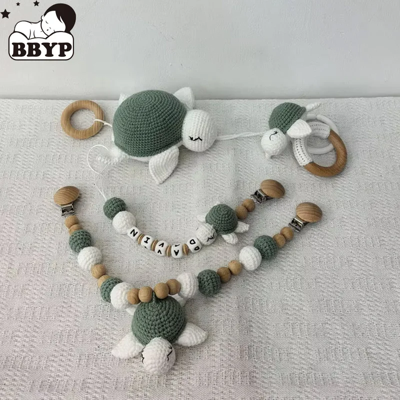 Kinderwagenkette Schnullerkette mit Namen, Fitnessstudio, pädagogischer Ring, Zahnspielzeug, Baby-Baumwollschildkröte, Holzring, Rassel, Häkelwolle Image