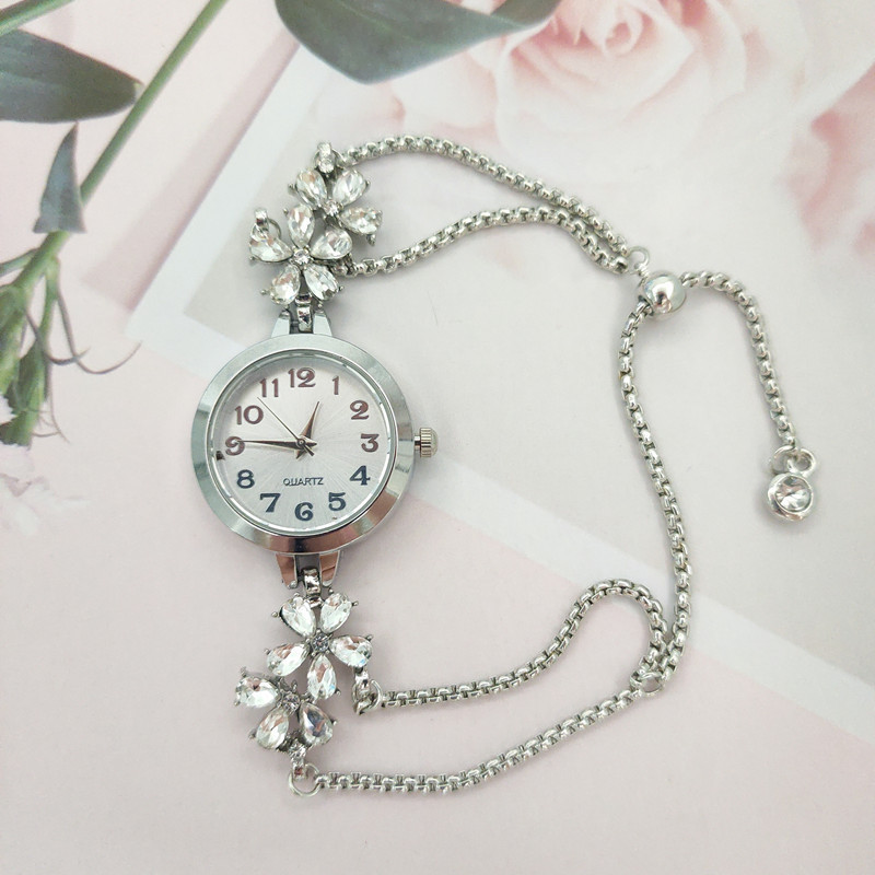 Elegant Women's Quartz Watch With Floral Diamond Accent & Adjustable Drawstring Bracelet silvery