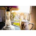 Teapot and lamp on windowsill in afternoon sun Baron s Court; West London England Poster Print (38 x 24)