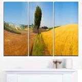 Design Art Tuscany Wheat Field Hill Panorama - 3 Piece Graphic Art on Wrapped Canvas Set Canvas in Blue | 28 H x 36 W x 1 D in | Wayfair PT11708-3P