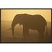 East Urban Home 'African Elephant Silhouetted at Sunset' Framed Photographic Print on Canvas in Brown/Yellow | 16 H x 24 W x 1.5 D in | Wayfair