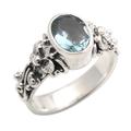 Frangipani Path,'Oval Cut Blue Topaz and Silver Ring with Floral Design'