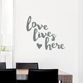 Wallums Wall Decor Love Lives Here Quote Wall Decal Vinyl, Glass in Gray | 28 H x 31 W in | Wayfair quotes-love-lives-here-31x28_gray