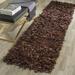 Brown 27 x 1 in Area Rug - Wade Logan® Assar Shag Saddle Area Rug Leather | 27 W x 1 D in | Wayfair 79BE832972CE4D28A5CA11DDCEB5CB55