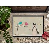 Caroline's Treasures Christmas Presents Between Friends West Siberian Laika Spitz Outdoor Door Mat Rubber in White | 24 W x 36 D in | Wayfair