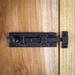 The Renovators Supply Inc. Wrought Iron Cabinet Sliding Bolt Door Latches 4" W Rust Resistance in Black | 1.5 H x 4 W x 1.25 D in | Wayfair 15804